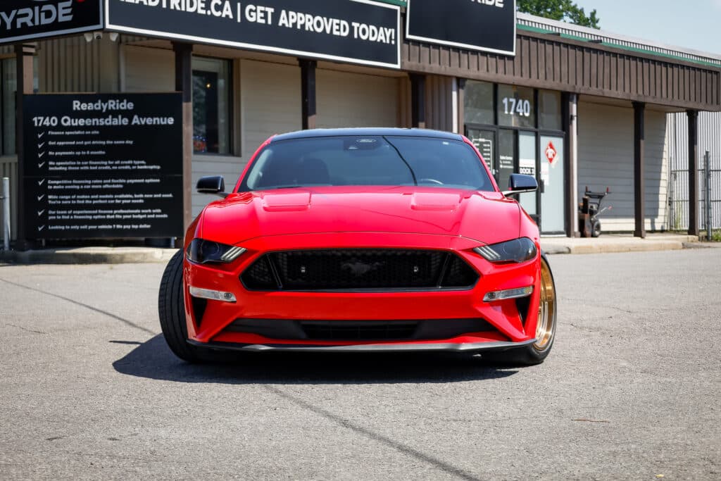 Ford Mustang outside the Ready Ride showroom